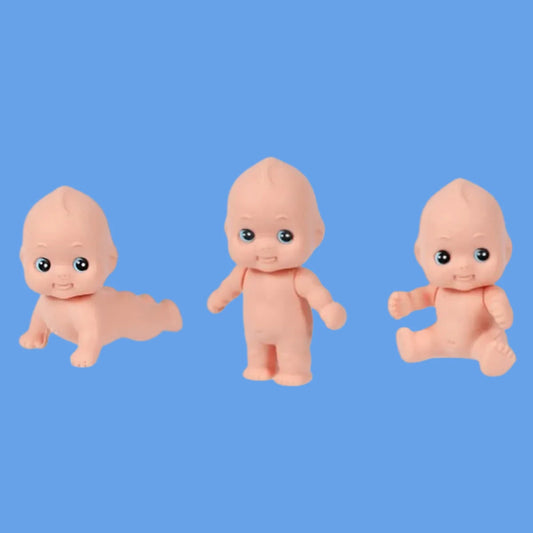 kewpie erasers in different poses on a blue background 
