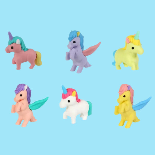 Set of colorful unicorn figurines on a white background